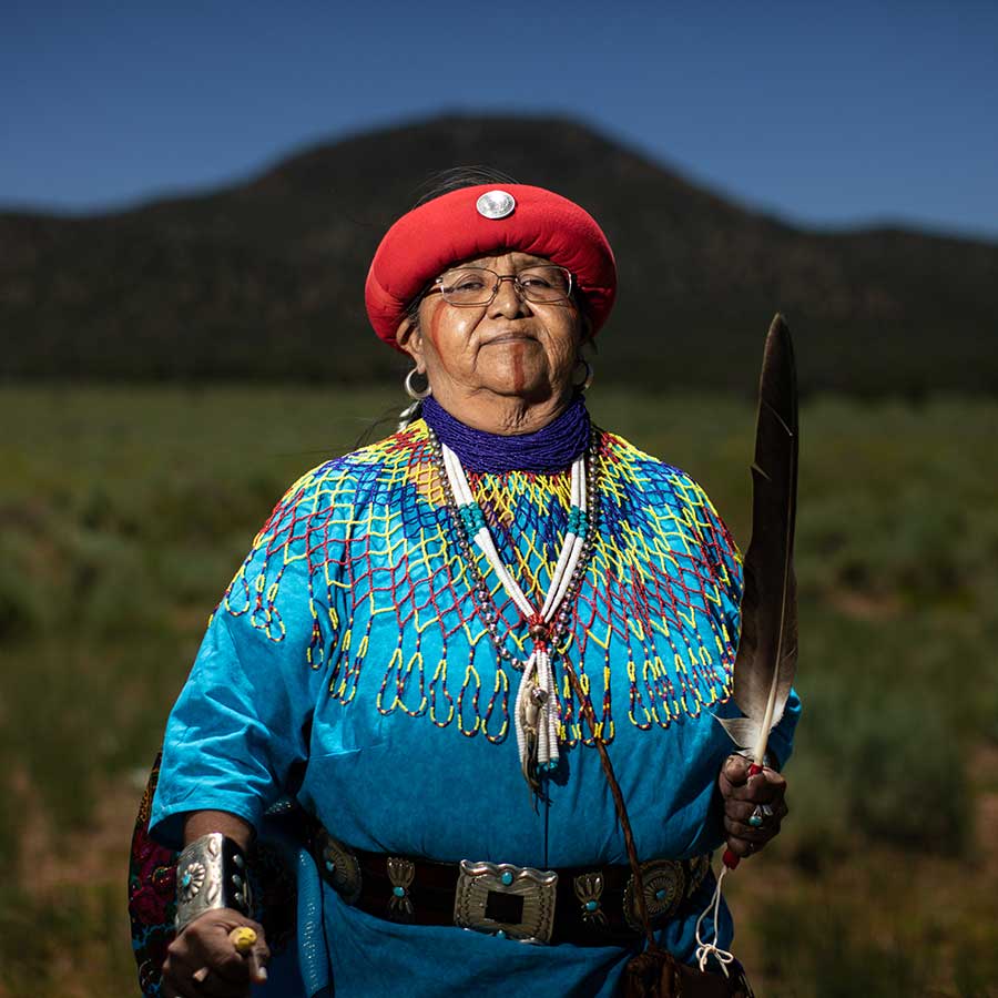 Dianna Sue White Dove Uqualla, Woman in a red head covering and traditional Havasupai regalia